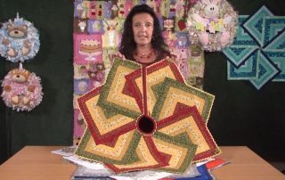 This is a delightful tree skirt pattern from Gail Penberthy, which could also work as a table centre, and is created with simple strip piecing and looks good in a wide variety of colours.