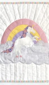PRODUCT OF THE MONTH FOR JUNE 2024: Rainbow Unicorn wallhanging by Kjersti Smith